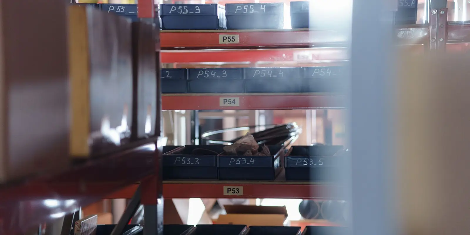 Labelled bin locations on racking in a maintenance parts store