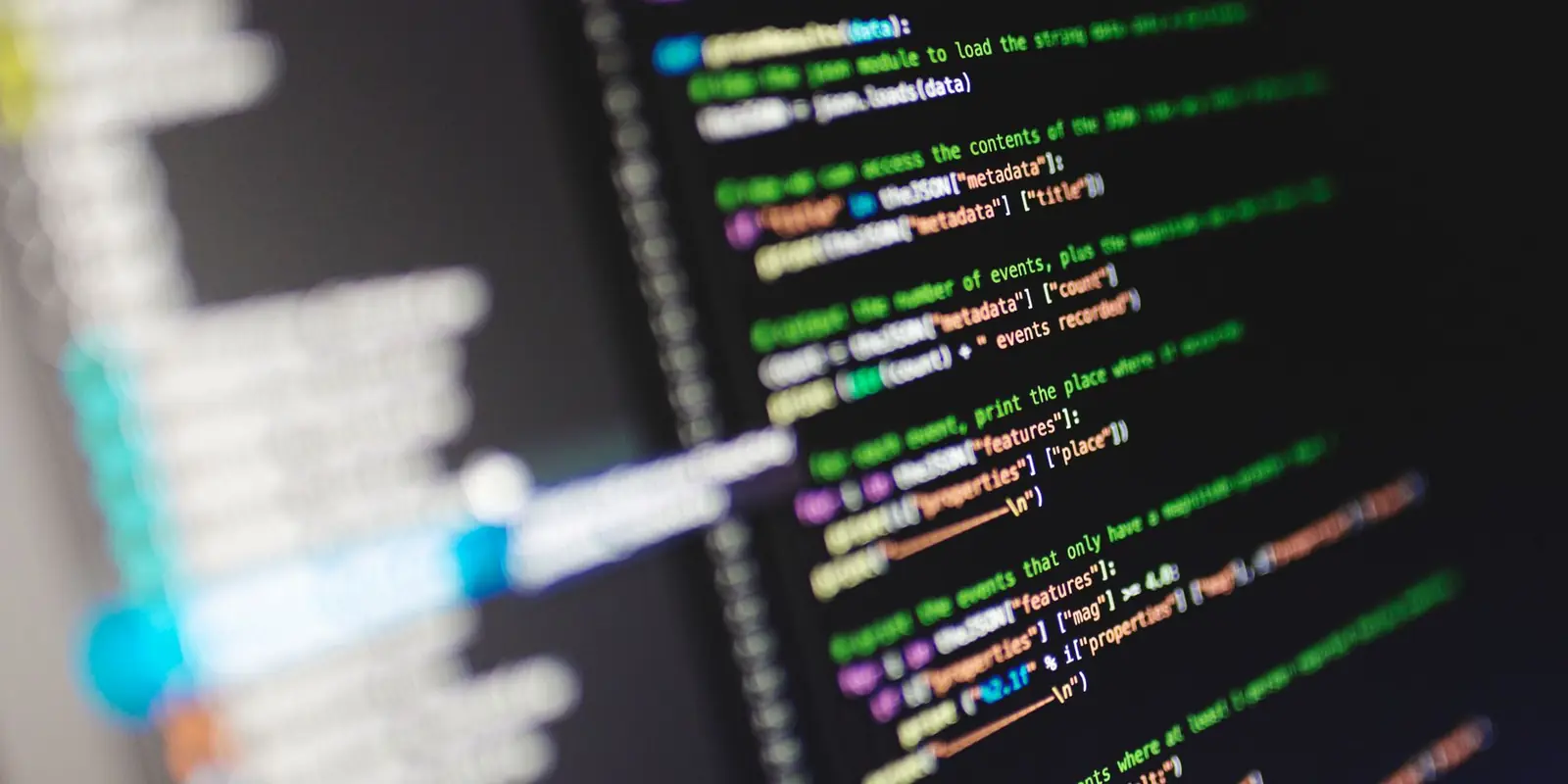 Colour-coded source code on a monitor, seen at an angle